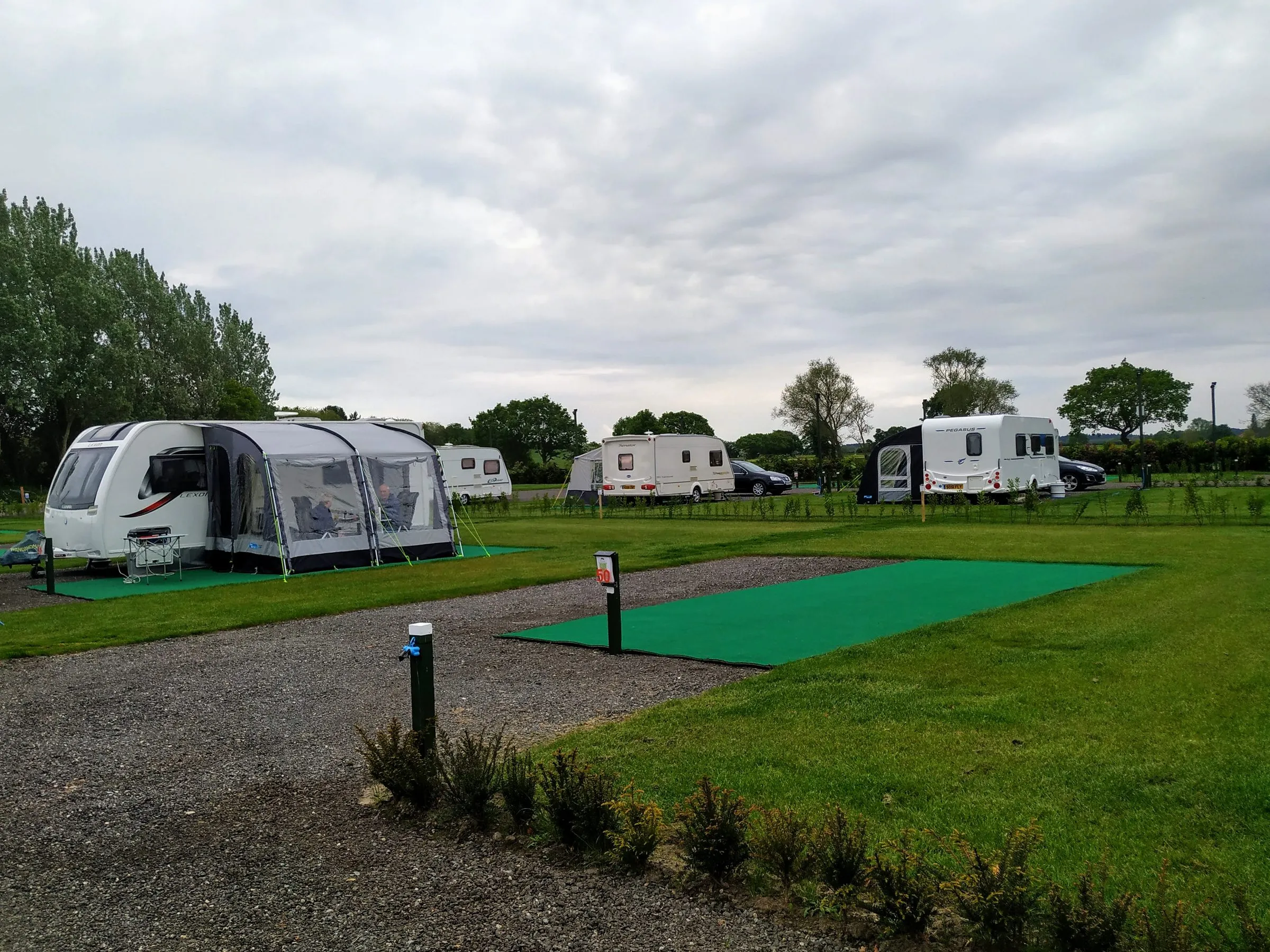 A seasonal pitch with an awning on the AstroTurf base